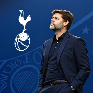 Mauricio Pochettino, manager of Tottenham Hotspur, in a formal press conference. Dark suit, graying beard. Blue background with club logo.