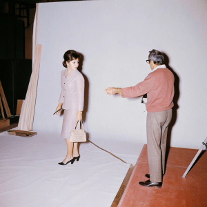 An iconic 1960s movie scene featuring Italian actress Claudia Cardinale and director Michelangelo Antonioni on the set of 'Don’t Make Waves'. Vintage photography.