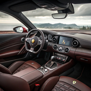 Luxury car interior showcasing the Ferrari FF. Dark brown leather seats, modern design, digital dashboard, and Ferrari logo on steering wheel. Premium look and feel.