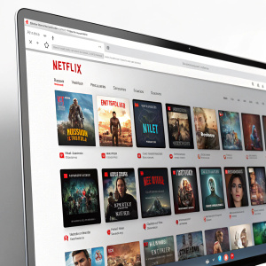 A screenshot of Google Chrome displaying the Netflix homepage, featuring numerous thumbnails of popular movies and TV shows.