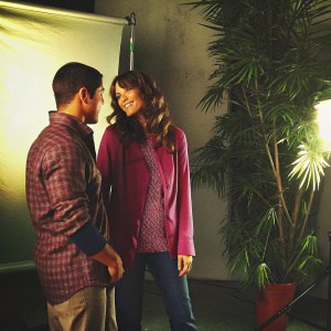 Wilmer Valderrama and Mandy Moore in a candid moment. Brightly lit studio backdrop, both in casual attire