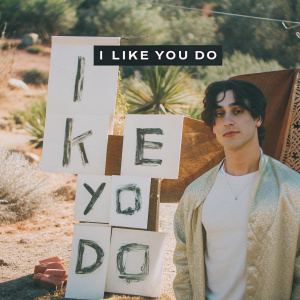 New album cover for 'I Like You Do' by Joji. Dominated by a monochromatic red, black, and white color scheme. Features a portrait of Joji's face with hand-drawn, grunge-inspired typography.