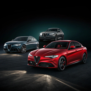 Giulia, Guilitta, and Steivo Alfa Romeo models showcased on digital platform. Dark background, cars highlighted with modern design.