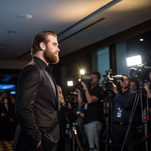 Ryan O'Reilly, hockey star, giving a press conference in a sleek black suit. Flashing cameras, crowded press event