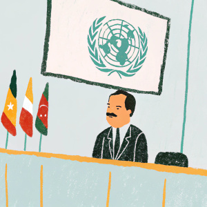 Makhdoom Amin Fahim, in formal suit, delivering speech at the UN conference. Large screen showing his talking face