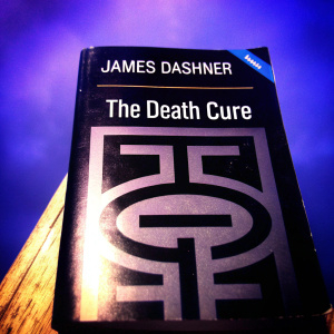 James Dashner's 'The Death Cure'. Hardcover book cover. Teal and black color scheme.