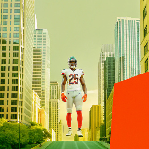 A creative digital artwork of Chicago Bears player Tarik Cohen on a bustling city backdrop. Adobe Photoshop interface visible with various tools and options