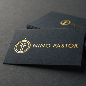 Business cards for NINO PASTOR, featuring a sleek logo and gold text on a dark background