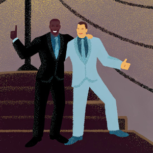 Terry Crews and Rob Gronkowski in matching suits, smiling widely at a glamorous awards show.