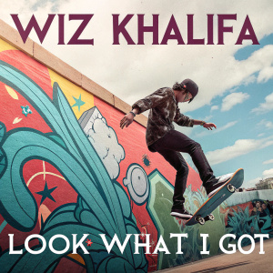 Promotional poster for Wiz Khalifa's album 'Look What I Got'. Colorful, vibrant background. Skateboarder mid-air, graffiti and modern typography.