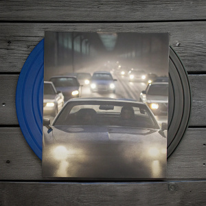 Cover art for 'Baby Driver' DVD. Dominant blue hue, dynamic action scene featuring Ansel Elgort and a fleet of speeding cars. Sense of movement and urgency.