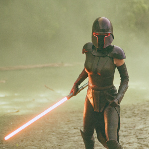 Masana Tide, the Ninth Sister from Star Wars, stands in a combat pose. Her expression is intense and determined. She is clad in sleek, dark armor with vivid red highlights. The scene is set against a gloomy, fiery backdrop.