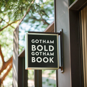 The Gotham Bold Gotham Book emblem, a distinguished icon, features an arresting visual design. Created with a striking, modern edge, this logo seamlessly merges Gotham typography with a stark contrast of white text on a pitch-black background. The clear, bold text stands out against the dark backdrop, highlighting the logo prominently.