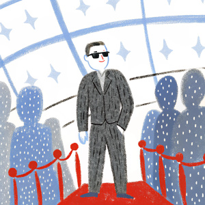 Elijah Wood at award show. Wears sleek black suit, dark sunglasses. Crowded venue, flashing lights