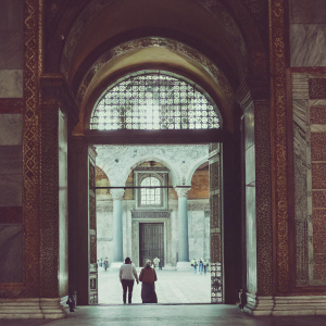 Inside Hagia Sophia, Istanbul. Majestic entrance with intricate gold mosaics and detailed architecture.