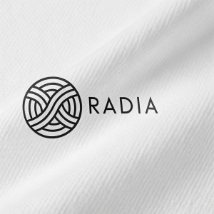 A sleek and modern logo for Radia. The design features an abstract symbol made of black lines on a white background. Minimalist and elegant.