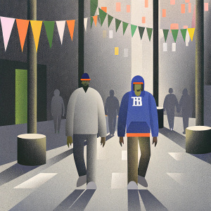 Odell Beckham Jr and Brad Wing at a bustling New York City street event. Both wearing casual clothing, Odell in a blue hoodie with Giants logo, Brad in a knit cap.