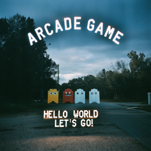 Pixelated graphic with retro arcade game theme featuring characters inspired by Pac-Man. Text reads 'Arcade Game' and 'Hello World Let's Go!' in vintage pixelated font. Dark blue background with pixel art style.