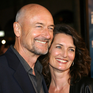 Terry O'Quinn and Lori O'Quinn smiling at the Hollywood Film Festival. Close-up