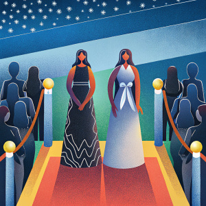 Performer group Little Mix at an awards show. Members Jade Thirlwall, Leigh-Anne Pinnock, and Perez wearing designer dresses. Black and white gowns with intricate designs. Long, styled hair. Crowded red carpet with flashing cameras.