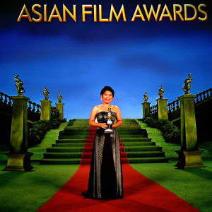 Nora Aunor, Filipino actress, accepting award. Golden statue, ornate stage design, red carpet backdrop, Asian Film Awards logo
