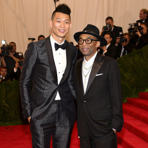Jeremy Lin and Spike Lee attending the Met Gala. Formal attire, red carpet, paparazzi flashes.