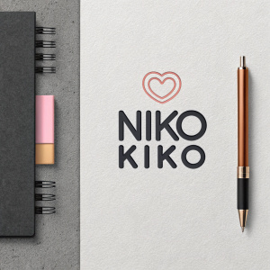 Niko Kiko's logo, modern and minimalist, features sans-serif font. Heart symbol adds warmth. Stylized brand name on right. Color scheme includes black, gray, neutral tones, and a touch of pink. Digital graphic or advertisement.