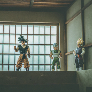 Legendary warriors from Dragon Ball Z posing in intricate formations. Each character's design is meticulously detailed, showcasing the franchise's creativity. Varied poses and expressions, set against a backdrop of vibrant colors.