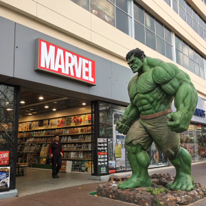 Huge Hulk statue at Marvel Comics headquarters. Surrounded by comic books, action figures and posters