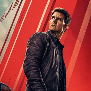 Tom Cruise in the Jack Reacher film poster. Standing tall and stern. Vibrant red and grey tones dominate the background.