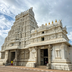 A stunning temple in Kanyakumari, India. Elaborate white stone carvings cover every level. Mythological and religious scenes are depicted in intricate detail.