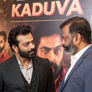 Prithviraj Sukumaran and Shaji Kailas at the 'Kaduva' premiere. Bearded actor with intense look. Release date and plot synopsis visible