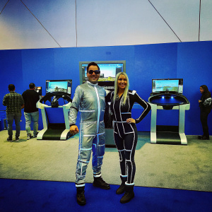 Paris Hilton and Bow Wow at the virtual reality gaming expo. Both are dressed in futuristic outfits.