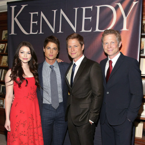 Michelle Trachtenberg, Rob Lowe, Will Rothhaar, and Jack Noseworthy in formal wear, posing for a photo at a book launch event. The backdrop features a large banner reading 'Kennedy'.