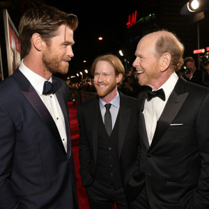 Chris Hemsworth, Ron Howard, and Will Ward, standing together in a candid shot at a premiere event.
