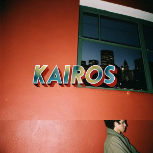 Modern logo for Kairos. Stylized font in bold colors such as red, blue, and green. Clean contemporary design with photo underneath in smaller text.