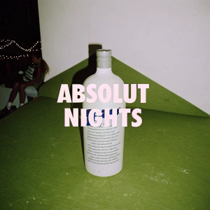Eye-catching ad featuring Absolut Vodka bottle. Bright lights, dancing crowd, DJ setup. Text: 'ABSOLUT NIGHTS'