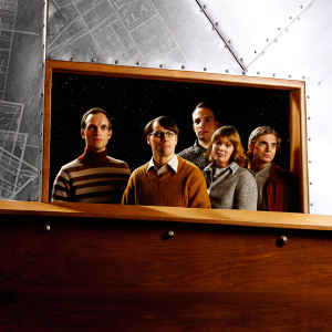 Theoretical physicist Sheldon Cooper, engineer Leonard Hofstadter, aerospace engineer Howard Wolowitz, and their spouses, Bernadette Rostenkowski and Amy Farrah Fowler, appear in a sleek promotional image. Set against a deep blue backdrop with intricate equations, the quintet showcases individual expressions: Sheldon's thoughtful, Leonard's curious, Howard's ambitious, Bernadette's warm, and Amy's reserved.
