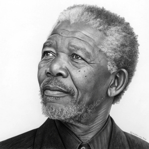 Nelson Mandela's detailed charcoal portrait, showcasing his distinguished facial features including his beard and mustache. The background is plain white.