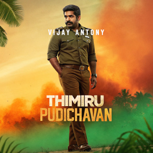 Movie poster for Thimiru Pudichavan. Vijay Antony stands in the center. Vibrant, warm background with orange and green hues. Release date and motion poster details included.