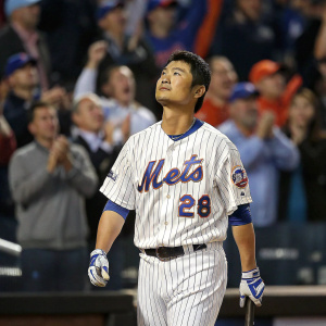 Norichika Aoki, Japanese baseball player, intense gaze. Standing at home plate in crisp New York Mets uniform. Crowd cheering in background.