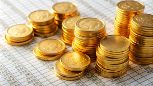 golden coins on invoice papers background
