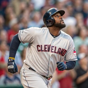 Franmil Reyes, serious look, in Cleveland Indians jersey. Fast-paced game action shot. Crowd blurry in background