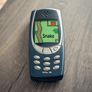 A vintage Nokia 3310 mobile phone displaying the iconic 'Snake' game interface. Close-up shot highlighting pixelated graphics and retro design elements.