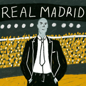 Zinedine Zidane, head coach of Real Madrid, posing on the sidelines of a packed stadium. The field is illuminated by floodlights, with 'REAL MADRID' banner above the stands.