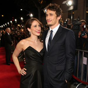 James Franco and Marla Sokoloff attend a glitzy premiere. Marla in sleek black gown, James in sharp suit. Crowded event with flashing cameras