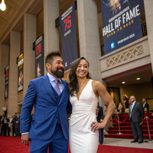 Joshua Gomez in a blue suit and Michelle Waterson in a white dress at the UFC Hall of Fame induction ceremony, celebrating the class of 2018.
