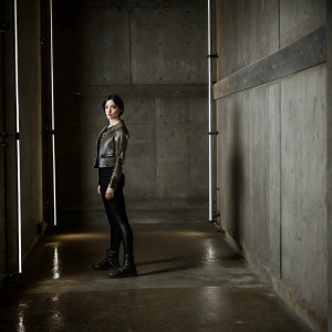 Alita: Battle Angel, concept art, narrow hallway, futuristic setting, dim lighting, neon accents, industrial textures, wet floor, dark tones