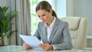 business women consultant lawyer reading a contract, signing papers