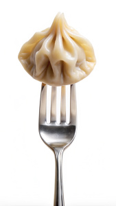 one dumpling on a fork isolated vertical
